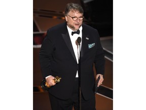 Guillermo del Toro accepts the award for best director for "The Shape of Water" at the Oscars on Sunday, March 4, 2018, at the Dolby Theatre in Los Angeles.