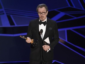 Gary Oldman accepts the award for best performance by an actor in a leading role for "Darkest Hour" at the Oscars on Sunday, March 4, 2018, at the Dolby Theatre in Los Angeles.