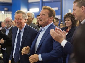 Republican centrists, from left, Ohio Gov. John Kasich, former California Gov. Arnold Schwarzenegger, and New Way California founder, Assemblyman Chad Mayes, appear at the first New Way California Summit, a political committee eager to reshape the state GOP, at the Hollenbeck Youth Center in Los Angeles Wednesday, March 21, 2018.