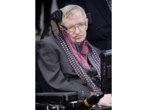 FILE - In this March 30, 2015 file photo, Professor Stephen Hawking arrives for the Interstellar Live show at the Royal Albert Hall in central London. Hawking, whose brilliant mind ranged across time and space though his body was paralyzed by disease, has died, a family spokesman said early Wednesday, March 14, 2018.