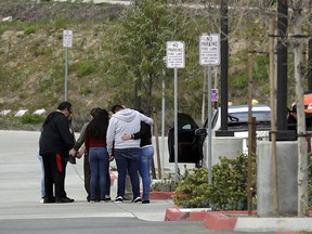 Family members and friends of Perla Morales Luna gather in front of the Otay Mesa Detention Center Tuesday, March 20, 2018, in San Diego. Morales Luna, a Mexican woman whose videotaped arrest for being in the U.S. illegally gained widespread attention online is being released on her own recognizance by an immigration judge in Southern California.