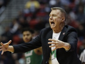 Marshall coach Dan D'Antoni reacts during the first half of a first-round game against Wichita State at the NCAA men's college basketball tournament, Friday, March 16, 2018, in San Diego.