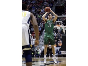 Marshall guard Jon Elmore (33) shoots against West Virginia during the first half of a second-round NCAA men's college basketball tournament game Sunday, March 18, 2018, in San Diego.