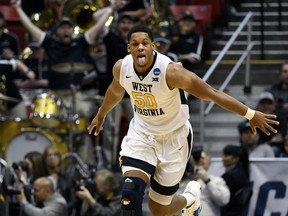 West Virginia forward Sagaba Konate (50) reacts after scoring during the second half of a second-round NCAA college basketball tournament game against Marshall, Sunday, March 18, 2018, in San Diego. West Virginia defeated Marshall 94-71.