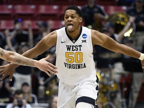 West Virginia forward Sagaba Konate (50) reacts after scoring during the second half of a second-round NCAA college basketball tournament game against Marshall, Sunday, March 18, 2018, in San Diego. West Virginia defeated Marshall 94-71.