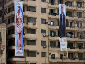 FILE - In this Thursday, March 22, 2018 file photo, election banners for Egyptian President Abdel-Fattah el-Sissi, hang in Tahrir Square, which was the focal point of the Jan. 25, 2011 Egyptian uprising, in Cairo, Egypt. Seven years ago, Cairo's Tahrir Square was filled with tens of thousands of Egyptians demanding change. Now it is festooned with portraits of the president, vowing continuity. Almost all traces of the popular revolt that overthrew autocrat Hosni Mubarak in 2011 are now gone.