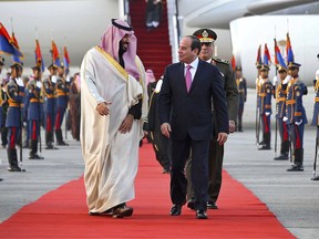 Egyptian President Abdel-Fattah el-Sissi, right, greets Saudi Crown Prince Mohammed bin Salman on his arrival to Cairo, Egypt, for a visit meant to deepen the alliance between two of the region's powerhouses, Sunday, March 4, 2018. Soon after the prince touched down in Cairo Sunday, el-Sissi's office said "regional issues" and Egypt's fight against Islamic militants were discussed by phone with U.S. President Donald Trump.