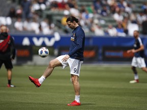 Los Angeles Galaxy's Zlatan Ibrahimovic, of Sweden, warms up before the team's MLS soccer match against the Los Angeles FC, Saturday, March 31, 2018, in Carson, Calif.