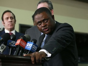 Pathologist, Dr. Bennet Omalu, discusses the results of the autopsy he conducted on police shooting victim Stephon Clark, during a news conference, Friday, March 30, 2018, in Sacramento, Calif. Omalu, who was hired by the family to conduct an independent autopsy, said Clark was shot seven times from behind and took up to 10 minutes to die.