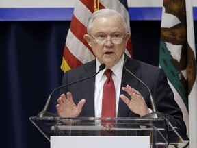 U.S. Attorney General Jeff Sessions addresses the California Peace Officers' Association 26th Annual Law Enforcement Legislative Day, 7, 2018, in Sacramento, Calif. The Trump administration on Tuesday sued to block California laws that extend protections to people living in the U.S. illegally.