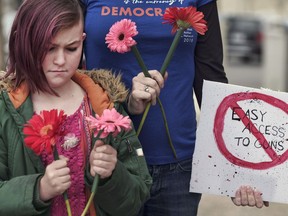 Student Tanner McPherson, 10, pauses for a moment of silence during a student protest in the Studio City section of Los Angeles, Sunday, March 11, 2018. The student-activist group "No Guns LA" held a rally to call for stricter gun control laws. The action was held in the wake of the school shooting at Marjory Stoneman Douglas High School in Parkland, Florida, in February.