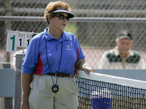 FILE - In this 2008 file photo tennis referee Lois Goodman is shown while officiating a CIF tennis tournament, in California. A Los Angeles tennis umpire arrested before a U.S. Open match and charged in her elderly husband's 2012 death is trying to clear her name. Lois Goodman's attorneys are expected to tell jurors Wednesday, March 21, 2018, in federal court that the Los Angeles coroner's office deprived her civil rights by falsifying an autopsy report.