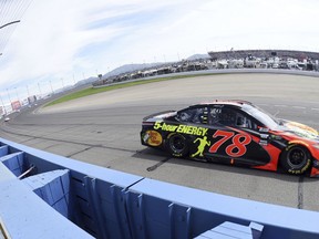 Race leader Martin Truex Jr. exits turn two during the NASCAR 400 mile auto race Sunday, March 18, 2018, at Auto Club Speedway in Fontana, Calif .