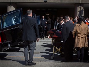 Pallbearers exit the funeral for triple homicide victims Krassimira, Roy, and Venallia Pejcinovski of Ajax at the St. Demetrios Greek Orthodox Church in Toronto on Saturday, March 24, 2018.