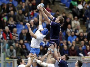 Scotland's Jonny Gray, right, and Italy's Dean Budd attempt to get the ball during the Six Nations rugby union match between Italy and Scotland at Rome's Olympic stadium, Saturday, March 17, 2018.