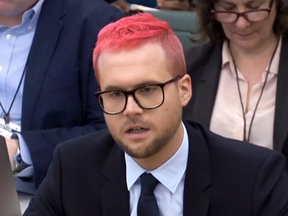 Canadian data analytics expert Christopher Wylie who worked at Cambridge Analytica appears as a witness before a committee of British MPs on March 27, 2018 as part of the committee's investigation into fake news.