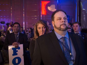 Doug Ford supporters listen as Hartley Lefton, Chair of the Leadership Election Organising Committee announces the delay of the Ontario PC Leadership announcement, after confusion over the results, in Markham, Ont., on Saturday, March 10, 2018.