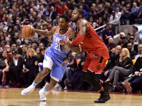 Lou Williams of the Los Angeles Clippers drives past defender CJ Miles of the Toronto Raptors during NBA action Sunday at the ACC.The Clippers were 117-106 winners.