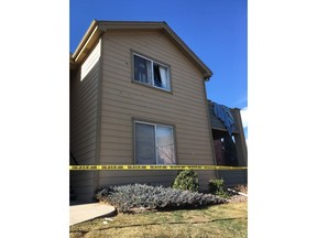 FILE - In this Jan. 1, 2018, file photo, Deputy Zack Parrish's a suburban Denver apartment building where he was fatally shot is riddled by bullet holes. Sheriff Tony Spurlock's office used social media heavily after Parrish's death, including a dramatic video posted to Facebook using body camera footage and other material to explain what led up to the shooting.