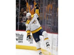 Nashville Predators left wing Austin Watson celebrates after scoring a goal against the Colorado Avalanche in the first period of an NHL hockey game Sunday, March 4, 2018, in Denver.