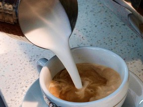 In this Sept. 22, 2017, file photo, a barista pours steamed milk in a coffee at a cafe in Los Angeles.