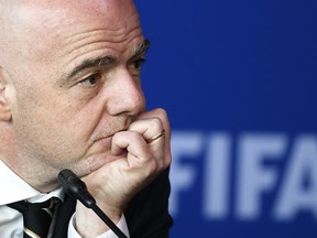 FIFA President Gianni Infantino listens to a reporter's question during a press conference after the FIFA Council Meeting, in Bogota, Colombia, Friday, March, 16, 2018. FIFA has finally and fully approved video review to help referees at the World Cup. The last step toward giving match officials high-tech help in Russia was agreed to on Friday by FIFA's ruling council chaired by Infantino.