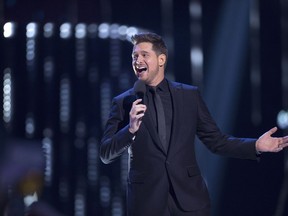 Host Michael Buble is shown on stage at the Juno Awards in Vancouver, Sunday, March, 25, 2018. It was a night of positivity at the Juno Awards as the stars of Canadian music focused on celebrating the upsides of life.