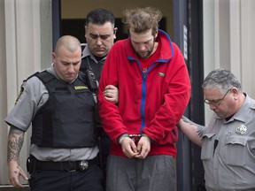 Codey Reginald Hennigar is taken from court in Dartmouth, N.S. on Friday, Jan. 9, 2015. A mentally ill Nova Scotia man who killed his mother and two grandparents will go before a review committee today to see if he will be allowed more freedom.
