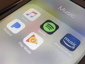 The Spotify music-streaming business is pitching a low-cost way for Canadians to create their own audio advertising. Music streaming apps, including Spotify, are seen on an iPhone in New York on Sunday, Jan. 28, 2018.