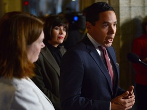 Indigenous Services Minister Jane Philpott (left) and Health Minister Ginette Petitpas Taylor (centre) look on as Inuit Tapiriit Kanatami (ITK) President Natan Obed addresses media in the Foyer outside the House of Commons in Ottawa on Thursday, Oct.5, 2017. The government is promising to cut in half the rate of active tuberculosis in Canada's North within the next seven years, ahead of its plan to eliminate the disease by 2030.