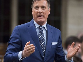 Conservative MP Maxime Bernier rises in the House of Commons in Ottawa on Friday, December 1, 2017. Bernier says he rejects an olive branch from Liberal Celina Caesar-Chavez for the two to get together and try and bridge the gap between them over issues of race and identity politics.