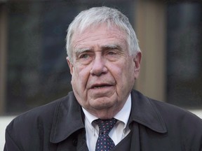 Bruce Carson leaves the courthouse after appearing in court for a verdict in his case, November 17, 2015 in Ottawa.