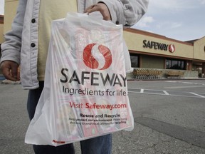 A customer leaves a Safeway store in Cupertino, Calif. Feb. 23, 2011. Manitoba Safeway workers voted on Sunday to ratify a four-year collective agreement with Sobeys, avoiding a strike.