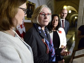 Minister of Crown-Indigenous Relations and Northern Affairs Carolyn Bennett, centre.