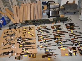 The Liberal government is planning to introduce long-promised legislation as early as Tuesday to strengthen controls on the movement, licensing and tracing of guns. A large cache of restricted and banned weapons seized by the Ontario Provincial Police is shown in Bancroft, Ont. in a handout photo.