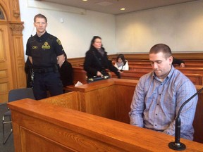Brandon Phillips sits the in Supreme Court of Newfoundland and Labrador in St. John's on Thursday Dec. 1, 2016. A Newfoundland man found guilty in the fatal shooting of a Good Samaritan who tried to intervene in a bar robbery has filed an appeal of his murder conviction.