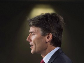 Vancouver Mayor Gregor Robertson speaks durning on Parliament Hill Tuesday in Ottawa.