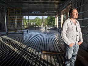 The popular restaurant-bar in Lac Megantic that became a symbol of the tragic 2013 train derailment that killed 47 victims is up for sale. Yannick Gagne stands in the new Musi-Cafe under construction in Lac-Megantic, Que., Wednesday, June 11, 2014.