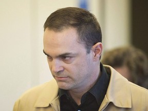 Guy Turcotte walks towards the courtroom at the Saint Jerome courthouse in Saint Jerome, Que., Saturday, December 5, 2015. A lawyer for an ex-cardiologist who murdered his two children is in a Quebec courtroom today to appeal the length of time his client must spend in prison before becoming eligible for parole.THE CANADIAN PRESS/Graham Hughes