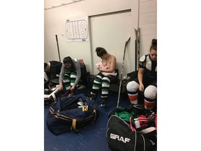 Serah Small breastfeeds her baby half clothed in her hockey gear in a photo posted on Milky Way Lactation Services' Facebook page. THE CANADIAN PRESS/HO-Facebook-Milky Way Lactation Services MANDATORY CREDIT