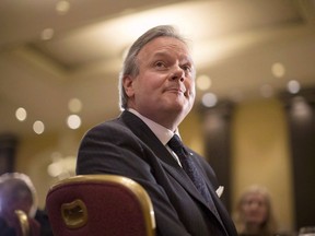 Bank of Canada Governor Stephen Poloz listens to remarks after addressing the Canadian Club of Toronto, on Thursday December 14, 2017. The governor of the Bank of Canada says the federal government's steps in the last couple of years to take on more public debt has helped prevent an even faster build-up of household debt that has still managed to climb to historic highs.