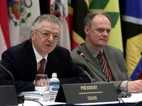 Marc Lortie, left, Prime Minister Jean Chretien's representative at the Summit of the Americas and Chair at the Summit Implementation Review Group, and Peter Boehm, representing Canada, attend the opening of a three-day meeting in Quebec City, Friday April 13, 2001. Boehm, Canada's G7 sherpa, says the previous Conservative government "suppressed" everything diplomats tried to do during its decade in power.