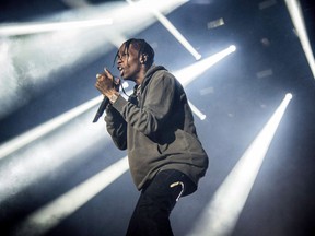 Travis Scott performs at the Okeechobee Music and Arts Festival on Saturday, March 3, 2018, in Okeechobee, Fla. Rapper Travis Scott and rock bands Florence and the Machine and Arctic Monkeys are headlining this year's Osheaga music festival in Montreal.