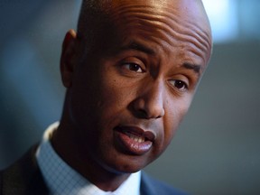 Immigration Minister Ahmed Hussen speaks to reporters prior to taking part in a citizenship ceremony at the National Arts Centre in Ottawa on Monday, Sept. 25, 2017. The federal Liberals say $173 million set aside in this week's federal budget to respond to asylum seekers crossing illegally into Canada doesn't mean a new surge of arrivals is expected this year.THE CANADIAN PRESS/Sean Kilpatrick