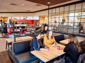 The revamped restaurant seating is shown at a Tim Hortons in this undated handout photo. Tim Hortons plans to renovate most of its Canadian restaurants over the next several years in what some franchisees say is another "ill-conceived" move that will cost individual restaurant owners about $450,000. The coffee-and-doughnut chain says it and its restaurant owners will invest $700 million to gussy up almost all its Canadian locations over the next four years.
