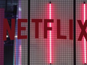 The logo of American entertainment company Netflix is pictured at the Paris games week in Paris, Saturday, Nov. 4, 2017. One in four anglophone Canadians have cut the cord and no longer pay for a traditional TV service, while just over half are Netflix users, according to a report by the Media Technology Monitor.THE CANADIAN PRESS/AP/Christophe Ena