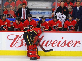 Calgary Flames players reckon with an eventual loss to the San Jose Sharks on March 16.