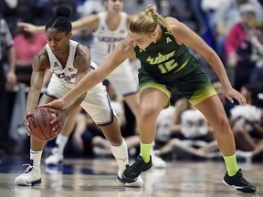 Connecticut's Crystal Dangerfield steals the ball from South Florida's Maria Jespersen, right, during the first half of an NCAA college basketball game in the American Athletic Conference tournament finals at Mohegan Sun Arena, Tuesday, March 6, 2018, in Uncasville, Conn.