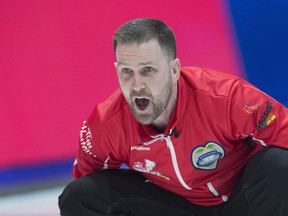 Team Canada skip Brad Gushue directs his sweepers as they play Alberta at the Tim Hortons Brier in Regina on March 7.