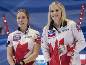 Canadian skip Jennifer Jones, right, and third Kaitlyn Lawes chat against the Czech Republic at the world championships in North Bay, Ont., on March 17.